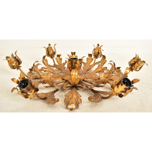 607 - An Italian inspired toleware style gilt metal six arm ceiling light. The chandelier having six arms ... 