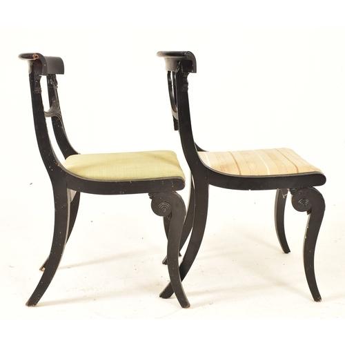 442 - A pair of Regency early 19th century ebonised wood dining chairs. Each chair having a curved top rai... 