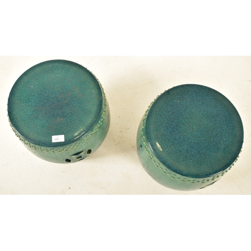 446 - A pair of Chinese green glazed terracotta garden patio stools seats. Each stool of barrel shape with... 