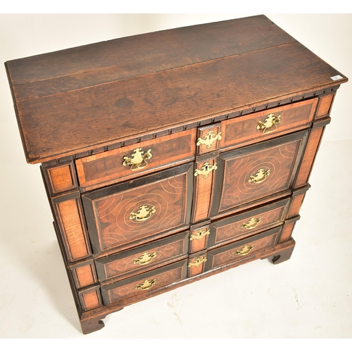 252 - A 17th century Queen Anne oak and walnut chest of drawers. The chest having a bank of four short and... 