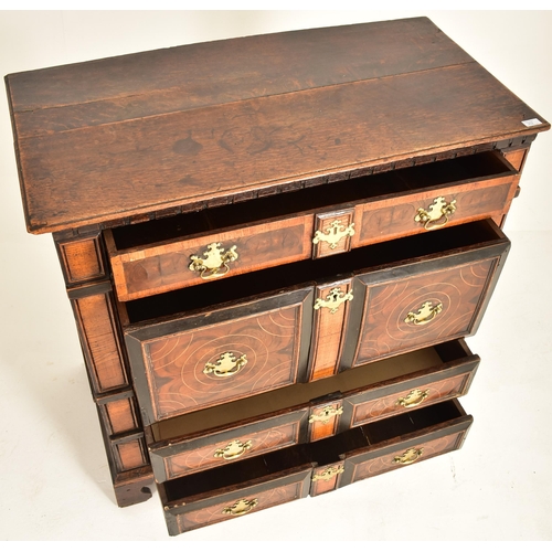 252 - A 17th century Queen Anne oak and walnut chest of drawers. The chest having a bank of four short and... 