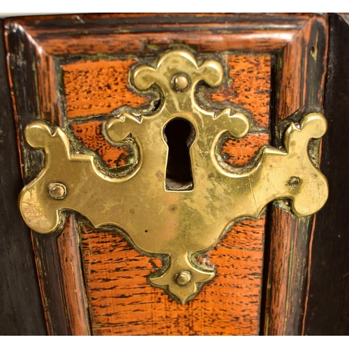 252 - A 17th century Queen Anne oak and walnut chest of drawers. The chest having a bank of four short and... 