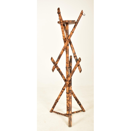 254 - A Victorian 19th century Aesthetic movement bamboo plant stand / jardinière. The torchere of bamboo ... 