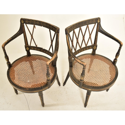 255 - A pair of Regency early 19th century ebonised & gilt parcel armchairs. Each chair having a lattice w... 