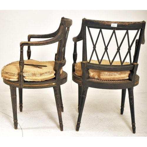 255 - A pair of Regency early 19th century ebonised & gilt parcel armchairs. Each chair having a lattice w... 