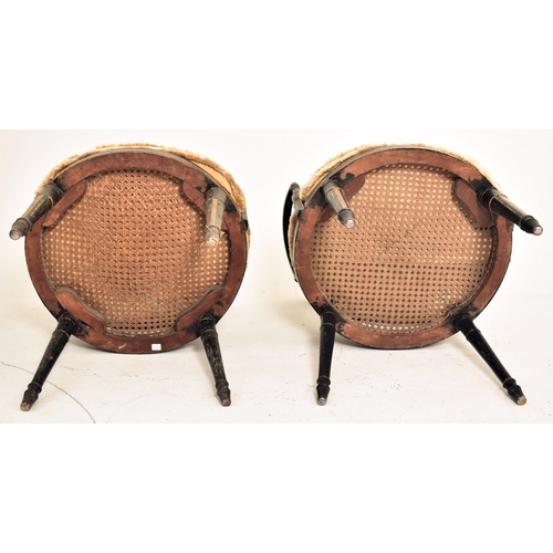 255 - A pair of Regency early 19th century ebonised & gilt parcel armchairs. Each chair having a lattice w... 