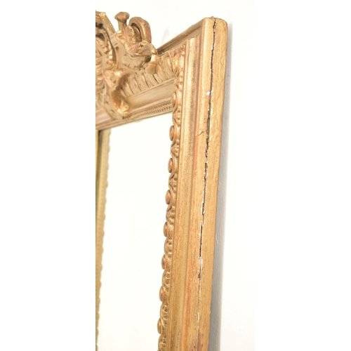 267 - A French Louis XVI manner early 20th century gilt wood mantle wall mirror. The mirror having an intr... 