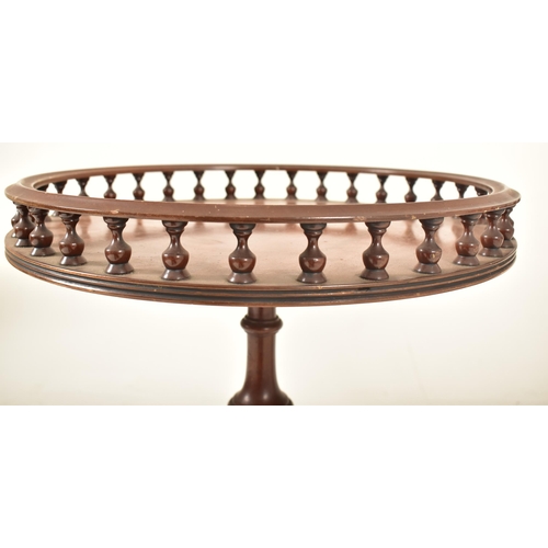 269 - A matched pair of Regency Revival mahogany gallery top tripod wine tables. Each having a turned spin... 