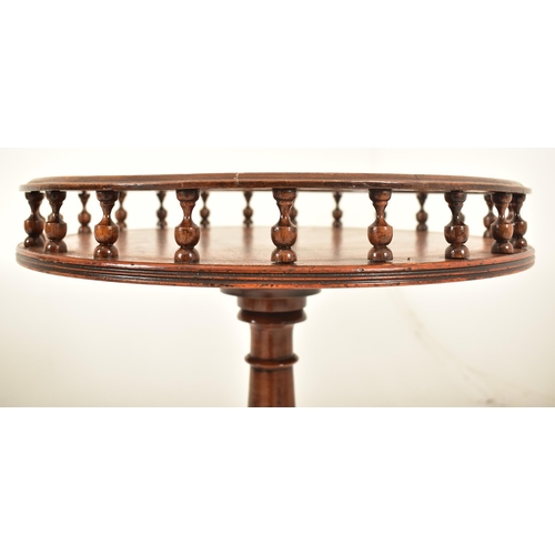 269 - A matched pair of Regency Revival mahogany gallery top tripod wine tables. Each having a turned spin... 