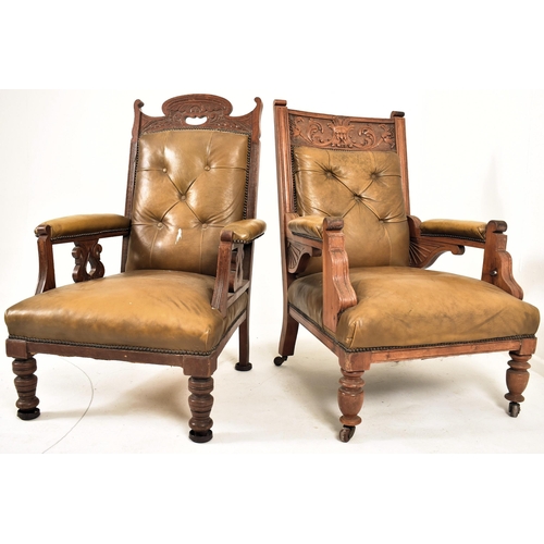 277 - A near matched pair of late Victorian carved oak & leather gentleman's library armchairs. The lot co... 