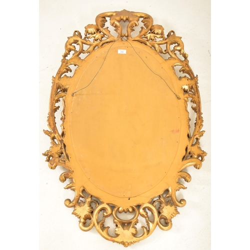 278 - A French inspired early 20th century carved gilt wood oval wall hanging mirror in the Napoleon III m... 