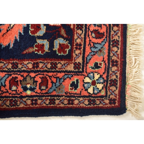 289 - A 20th century 1950s Lilihan Persian floor carpet rug runner. The runner having a cobalt blue ground... 