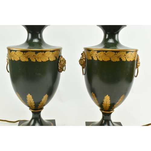 304 - A pair of Regency style toleware painted metal desk table lamps in the shape of handled urns. Each l... 