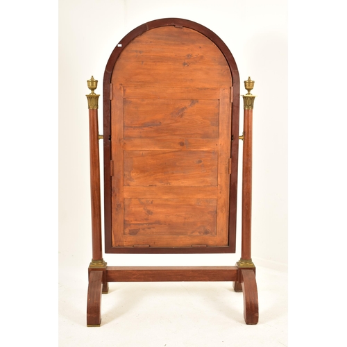 503 - A French Empire 19th century mahogany & brass cheval floor mirror. The mirror having curved top fram... 