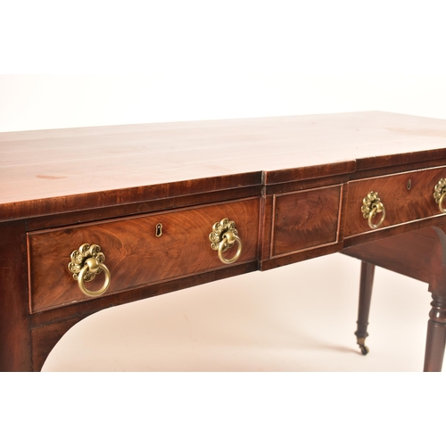 504 - A late 18th century George III mahogany credenza – sideboard. The credenza being raised on turned an... 