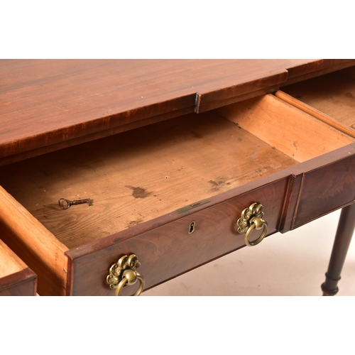 504 - A late 18th century George III mahogany credenza – sideboard. The credenza being raised on turned an... 