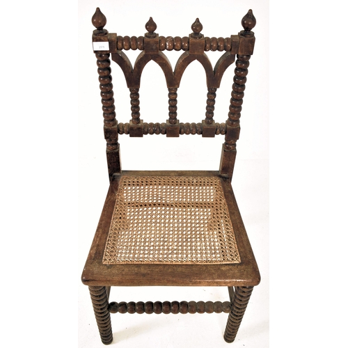 312 - An Arts & Crafts late 19th century Gothic inspired carved oak bobbin turned chair. The chair having ... 