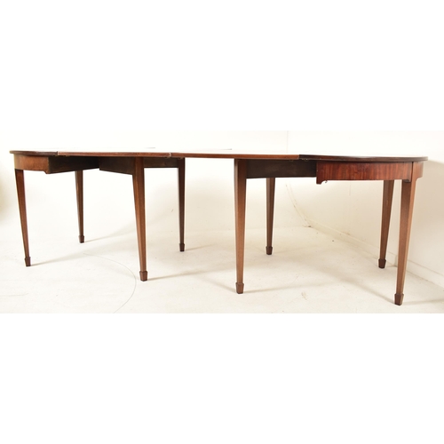 506 - A 19th century George III mahogany extending D-end table with and four chairs. The table having two ... 