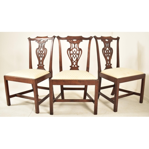 506 - A 19th century George III mahogany extending D-end table with and four chairs. The table having two ... 