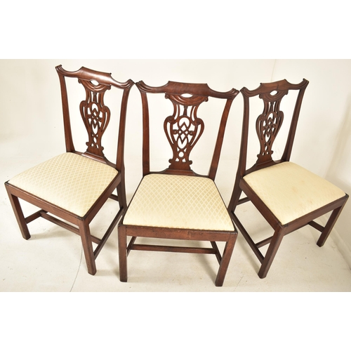 506 - A 19th century George III mahogany extending D-end table with and four chairs. The table having two ... 