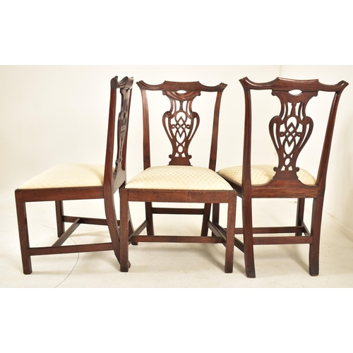 506 - A 19th century George III mahogany extending D-end table with and four chairs. The table having two ... 