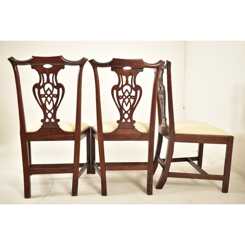 506 - A 19th century George III mahogany extending D-end table with and four chairs. The table having two ... 