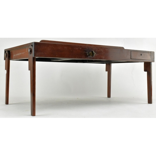 315 - A 19th century Victorian mahogany campaign folding bed table. The rectangular mahogany tray with rai... 