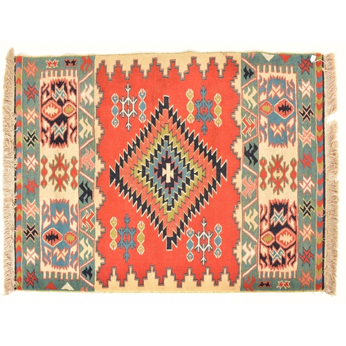 316 - A 20th century Afghan Islamic Kilim floor carpet rug. The carpet having a central geometric diamond ... 