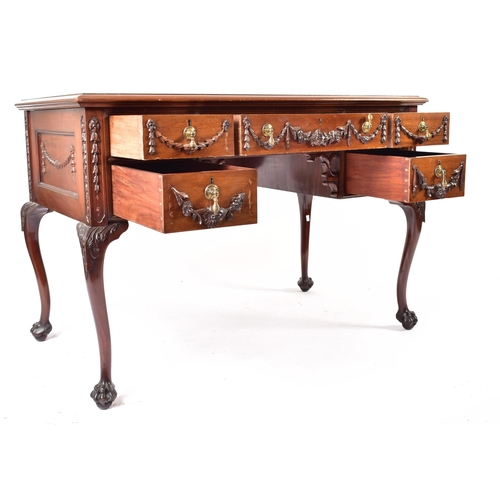 319 - A Robert Adams revival mahogany writing desk table. The desk having a central writing skiver surroun... 