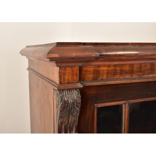 323 - A large George III early 19th century mahogany astragal glazed library bookcase cabinet. The cabinet... 