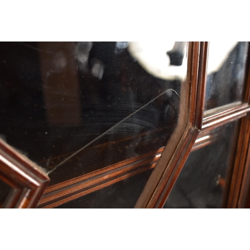 323 - A large George III early 19th century mahogany astragal glazed library bookcase cabinet. The cabinet... 