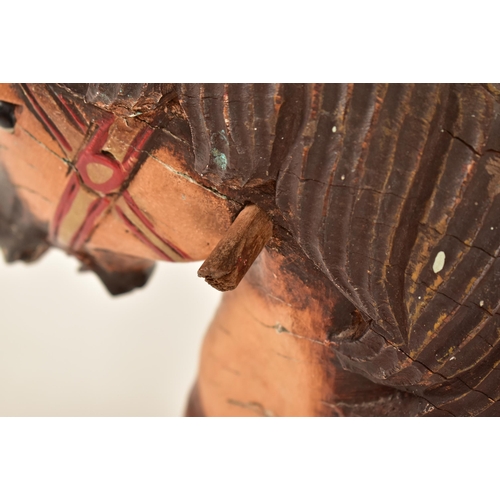 332 - A likely continental carved wood carousel horse adapted to a pull-a-long toy. The horse hand painted... 