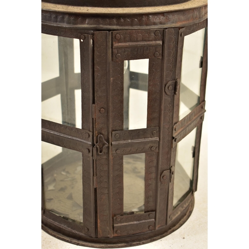 530 - A Moroccan inspired octagonal pierced metal & glazed ceiling lantern light. The lantern having ring ... 