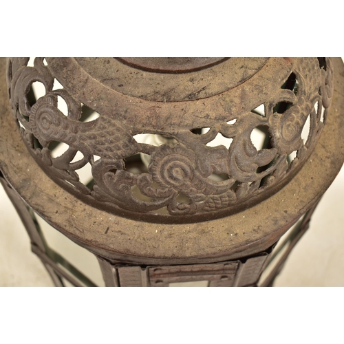 530 - A Moroccan inspired octagonal pierced metal & glazed ceiling lantern light. The lantern having ring ... 