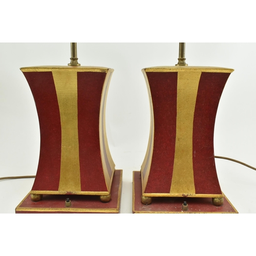 338 - Porta Romana - A pair of gold & red painted geometric desk table lamps. Each lamp with a brass light... 