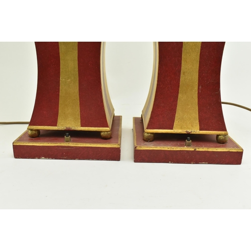 338 - Porta Romana - A pair of gold & red painted geometric desk table lamps. Each lamp with a brass light... 