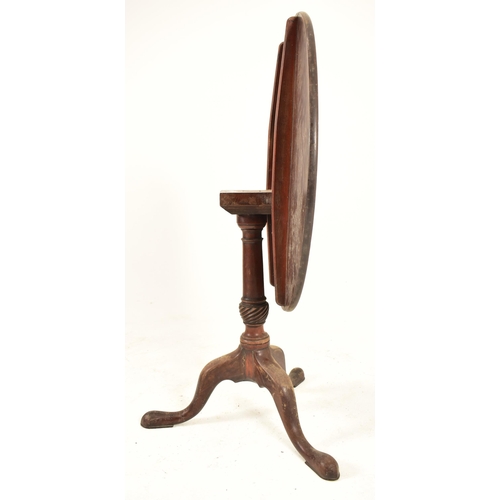 533 - A George III 18th century mahogany tilt top tripod table. The table having a circular hinged tilt to... 