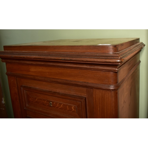 534 - A 20th century solid cast iron bachelor chest of drawers shaped floor safe. The safe in the shape of... 