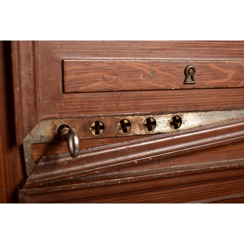 534 - A 20th century solid cast iron bachelor chest of drawers shaped floor safe. The safe in the shape of... 