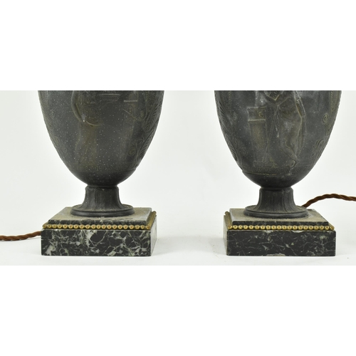 340 - A pair of Neoclassical style metal amphora urn shaped desk table lamps. Each lamp having a flared ne... 