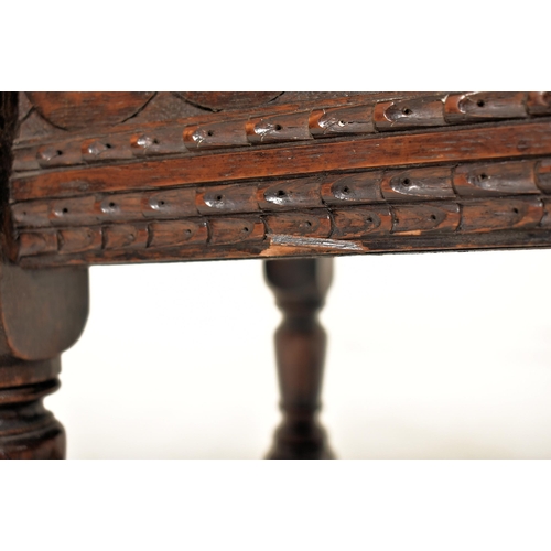 341 - A 17th century style carved oak lift top joint stool. The stool having a chamfered edge lift top ope... 