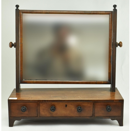 342 - A George III 19th century mahogany dressing table toilet swing mirror. The mirror having a central f... 