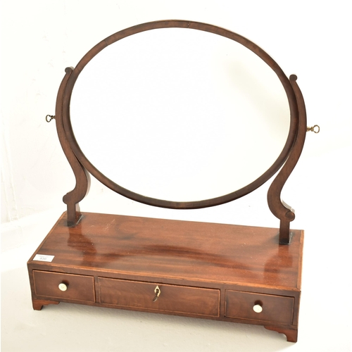 536 - A George III 19th century mahogany and boxwood inlaid toilet dressing table swing mirror. The mirror... 