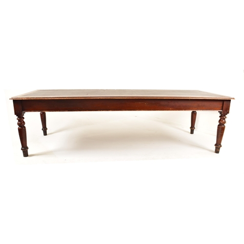 343 - A large Victorian 19th century boardroom / library table (refectory dining). The table having a cent... 