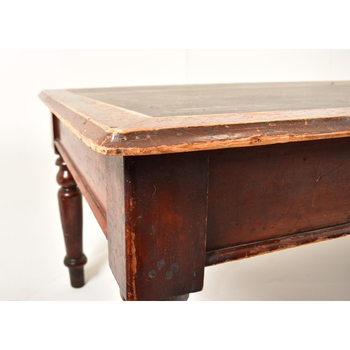 343 - A large Victorian 19th century boardroom / library table (refectory dining). The table having a cent... 