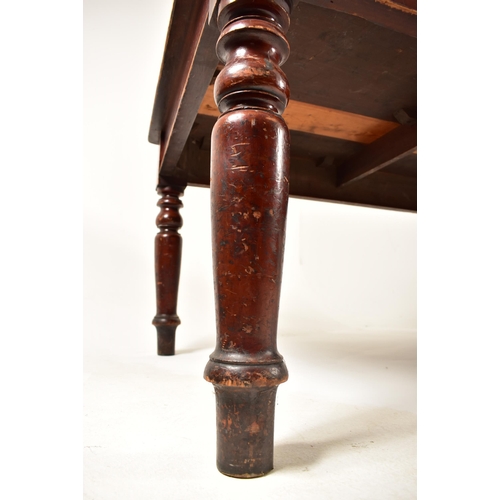 343 - A large Victorian 19th century boardroom / library table (refectory dining). The table having a cent... 