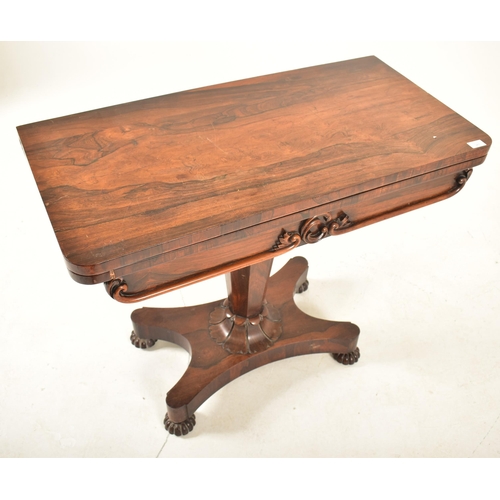 347 - A William IV 19th century rosewood card / games table. Raised on a quatrefoil base with bun feet. Ta... 