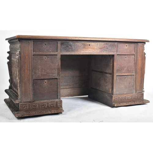 539 - A 16th century carved Italian large Cassone converted to a desk. The heavily carved front panel in r... 