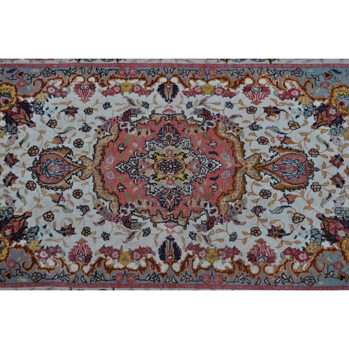 348 - A late 20th century wool with silk Iranian Persian Islamic raj Tabriz carpet floor rug. The rug havi... 