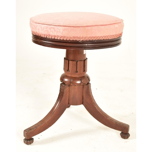 540 - A William IV 19th century carved rosewood piano revolving stool seat. The stool having a circular up... 